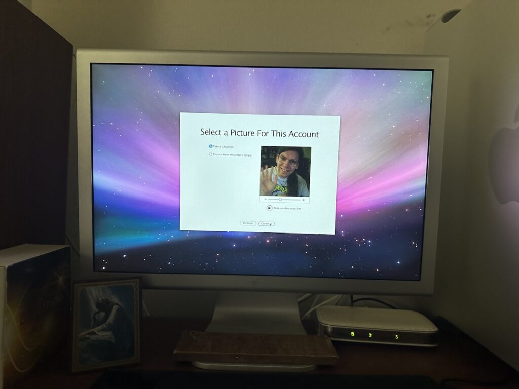 Mac OS X Setup Assistant showing "Select a Picture for This Account", and displaying output from an iSight camera.